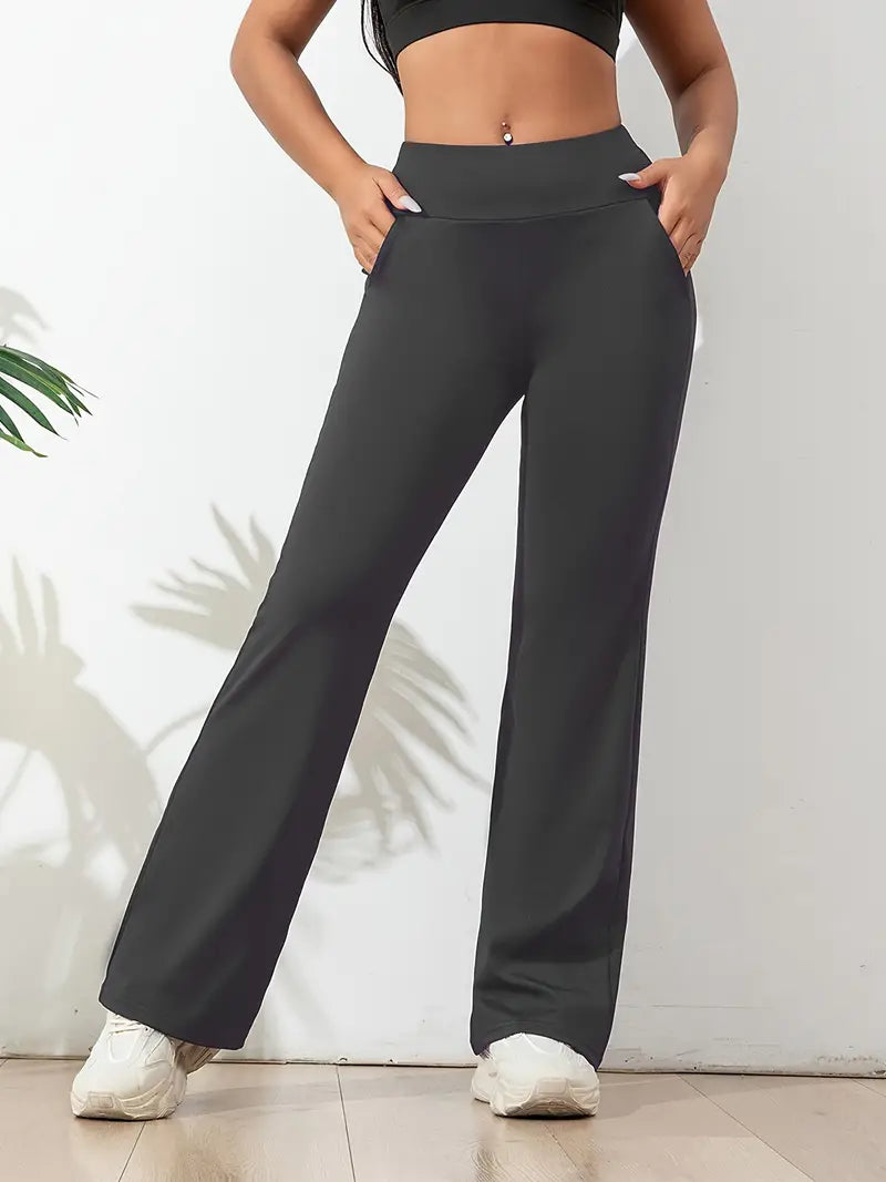 Legging noir taille haute pour femme, coupe évasée avec poches pratiques. Idéal pour le fitness, le yoga ou un look décontracté, alliant confort, flexibilité et style moderne.