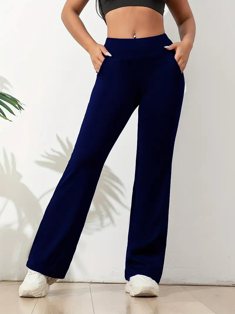 Legging bleu marine taille haute pour femme, coupe évasée avec poches latérales. Parfait pour le yoga, le sport ou les tenues décontractées, offrant confort, maintien et liberté de mouvement.