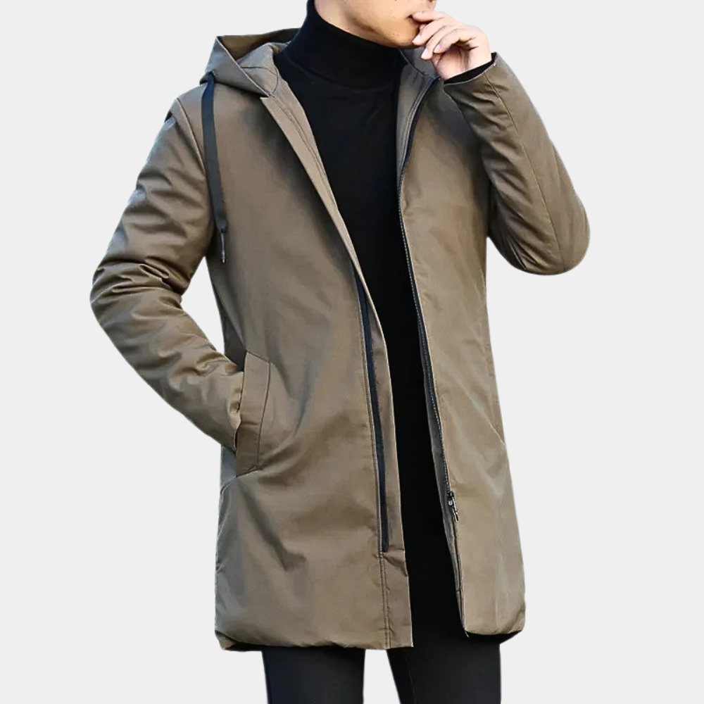 Man wearing a stylish long beige coat with a hood, featuring a zippered front and side pockets, perfect for winter warmth.