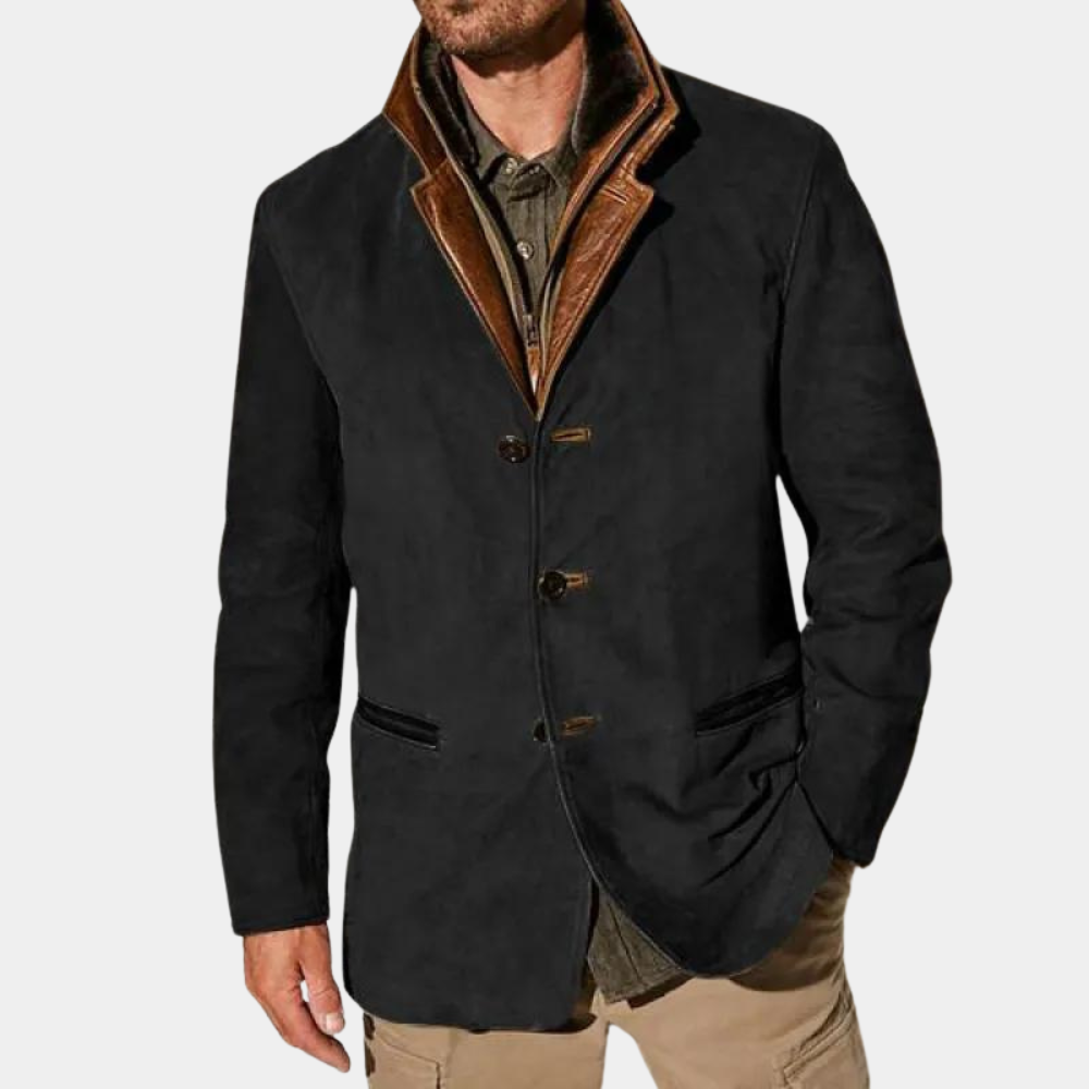 Blazer noir en suède avec col en cuir marron contrastant, coupe élégante à trois boutons et poches passepoilées, pour un style raffiné et moderne.