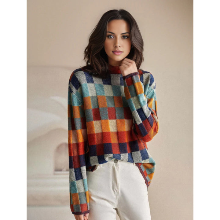 Pull Emphélie à carreaux tartan pour femme, motif tendance adapté aux tenues automnales colorées.