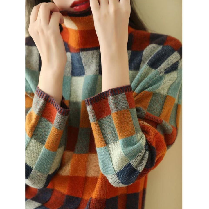 Pull Emphélie à carreaux tartan pour femme, motif tendance adapté aux tenues automnales colorées.