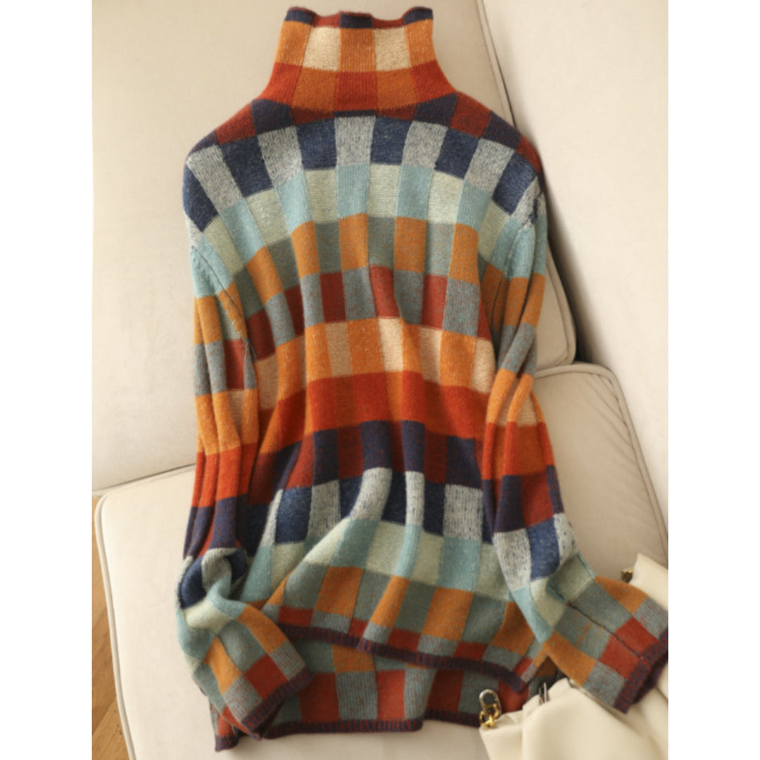 Pull Emphélie à carreaux tartan pour femme, motif tendance adapté aux tenues automnales colorées.