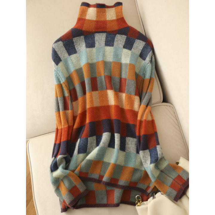 Pull Emphélie à carreaux tartan pour femme, motif tendance adapté aux tenues automnales colorées.