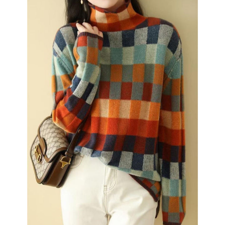 Pull Emphélie à carreaux tartan pour femme, motif tendance adapté aux tenues automnales colorées.