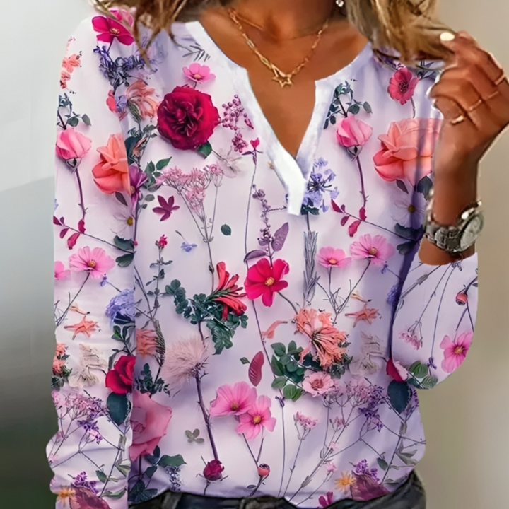 Blouse Eléane à imprimé fleuri pour femme, col V et coupe fluide adaptés aux tenues estivales.