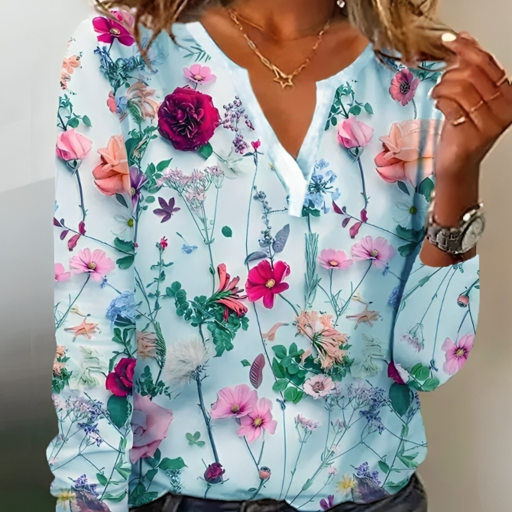 Blouse Eléane à imprimé fleuri pour femme, col V et coupe fluide adaptés aux tenues estivales.