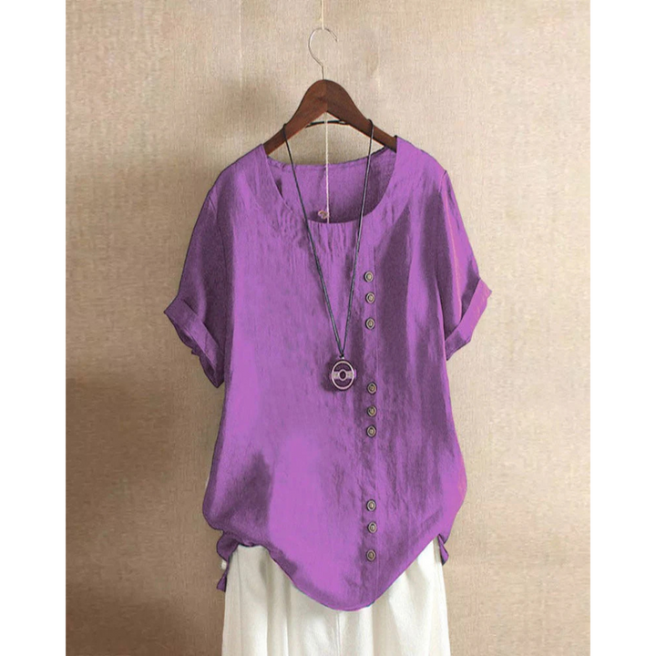 Blouse pour femme à manches courtes et col rond, teinte unie, coupe ample et tissu léger adapté aux journées chaudes.