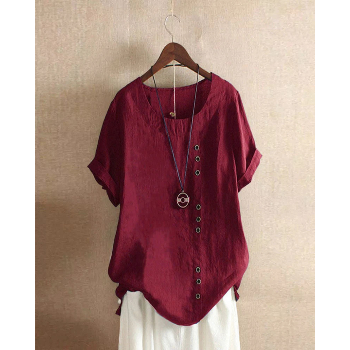 Blouse pour femme à manches courtes et col rond, teinte unie, coupe ample et tissu léger adapté aux journées chaudes.