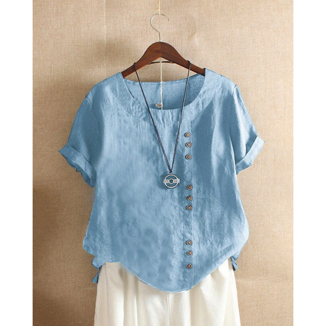 Blouse pour femme à manches courtes et col rond, teinte unie, coupe ample et tissu léger adapté aux journées chaudes.