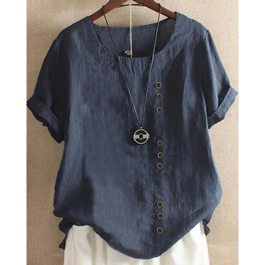 Blouse pour femme à manches courtes et col rond, teinte unie, coupe ample et tissu léger adapté aux journées chaudes.