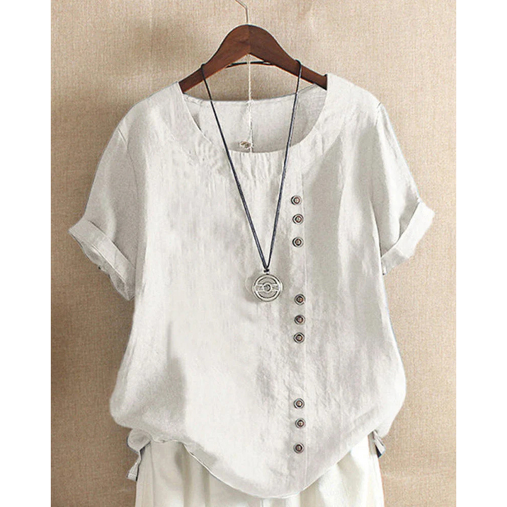 Blouse pour femme à manches courtes et col rond, teinte unie, coupe ample et tissu léger adapté aux journées chaudes.