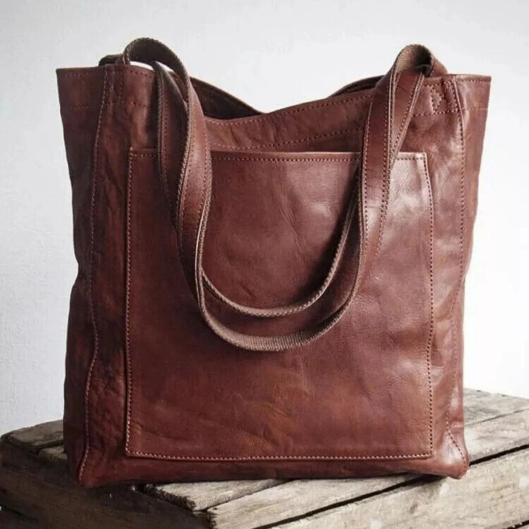 Sac tote grand format pour femme, bandoulière confortable et finitions soignées adaptées à l'usage quotidien.