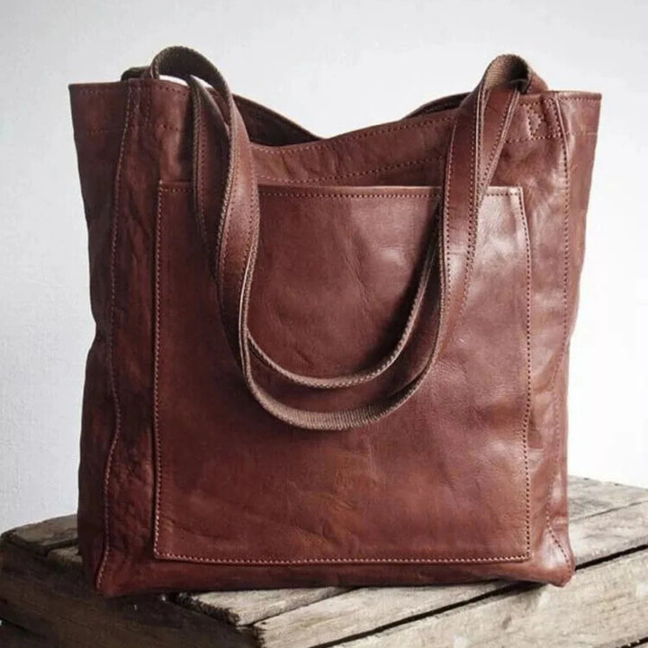 Sac tote grand format pour femme, bandoulière confortable et finitions soignées adaptées à l'usage quotidien.