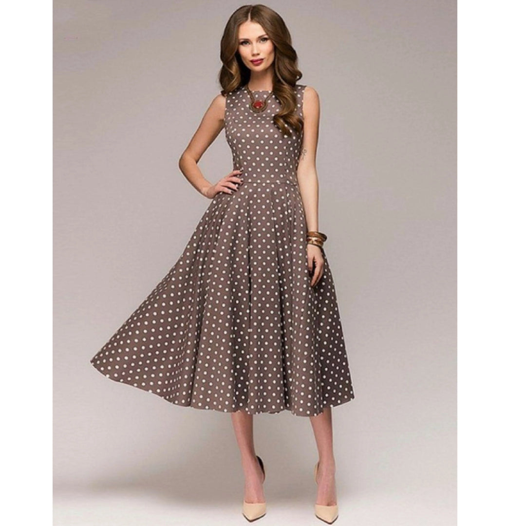 Robe à pois pour femme, coupe raffinée et motif rétro adapté aux tenues polyvalentes.
