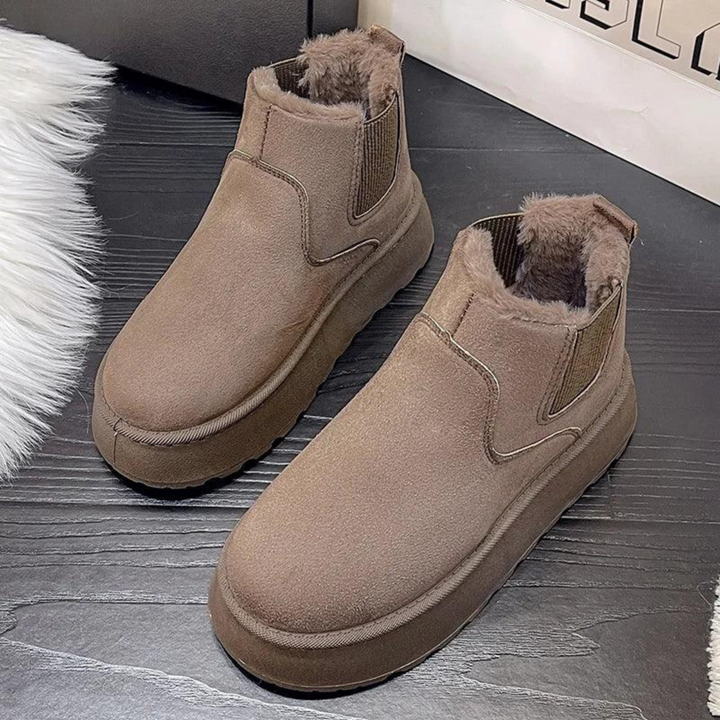 Bottines Malorie d'hiver protectrices pour femme, adaptées aux tenues hivernales polyvalentes.