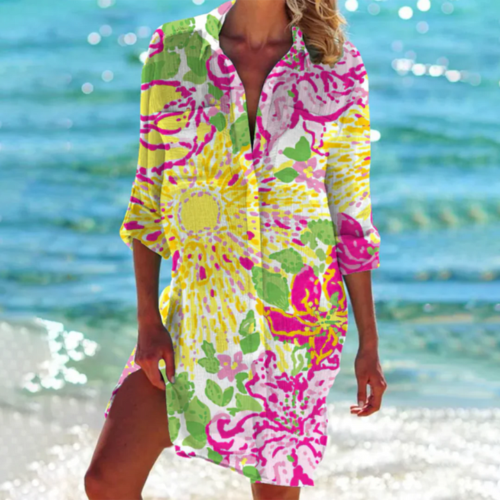 Son motif floral vibrant avec des teintes de rose, jaune et vert sur fond blanc évoque la fraîcheur et la gaieté des journées ensoleillées.