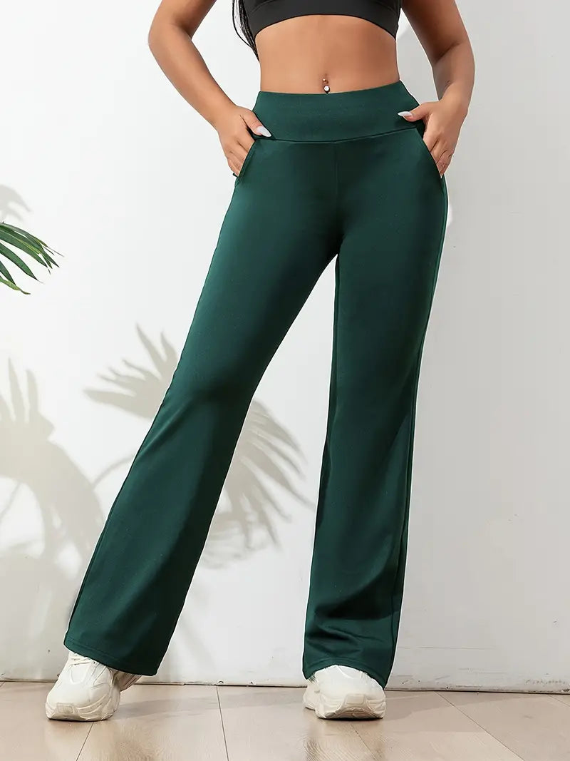  Legging vert foncé taille haute pour femme, coupe évasée, avec poches latérales pratiques. Idéal pour le sport, le yoga ou un look décontracté, offrant confort, maintien et liberté de mouvement.