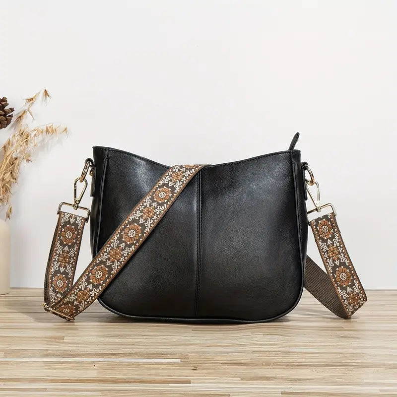 Sac Delvine bandoulière pour femme, design tendance et bandoulière ajustable adapté aux tenues polyvalentes.