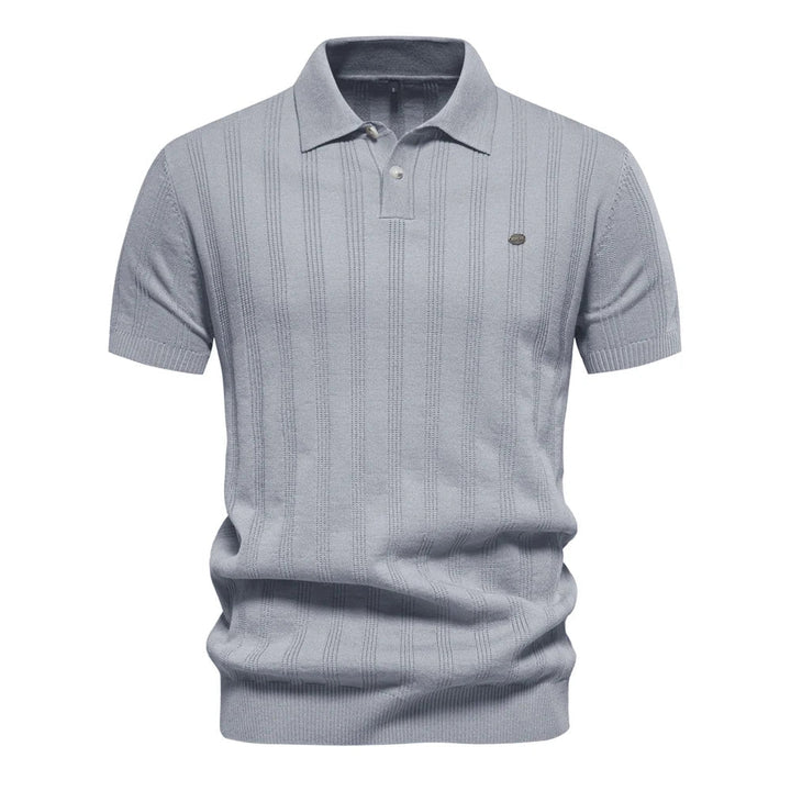 Polo en maille pour homme Florentin, design moderne avec fines rayures verticales, coupe élégante, col classique et manches courtes, en coloris gris pour un style chic et contemporain.