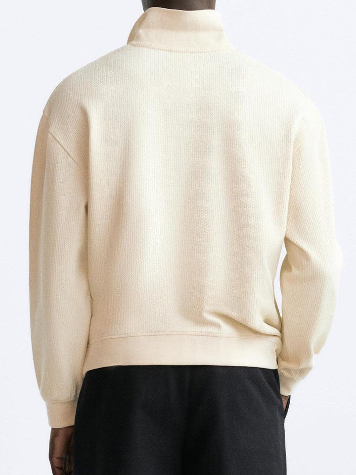 Vue arrière du polo à manches longues pour homme Gaspard en beige, avec col structuré et coupe moderne, parfait pour un look élégant et confortable au quotidien.