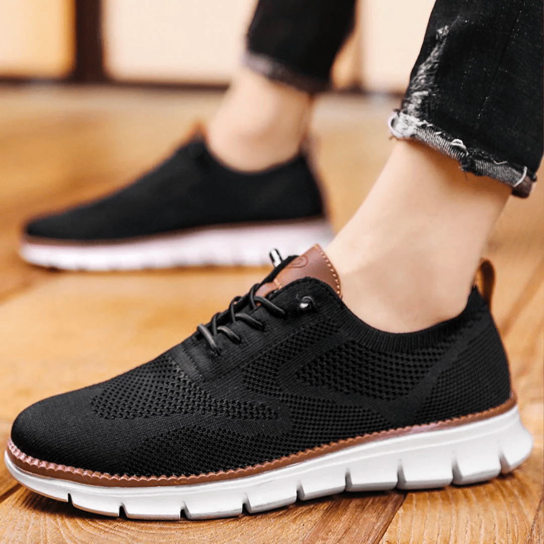 Jean, baskets tendance pour hommes à lacets noires, design respirant avec semelle blanche souple, parfaites pour un style décontracté