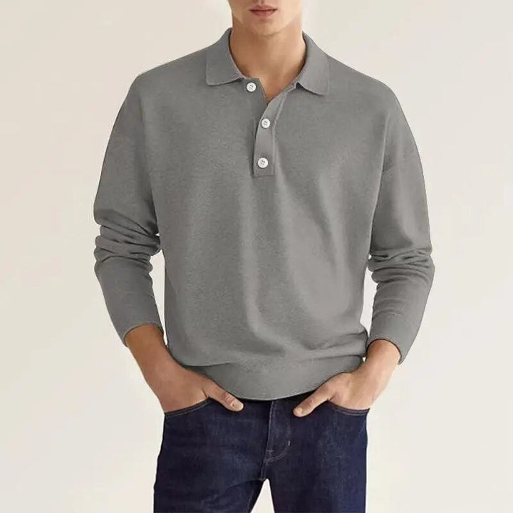 Le polo homme manches longues en couleur gris moyen combine confort et modernité. Avec son col classique et ses boutons discrets, il crée un look élégant et intemporel. Ce polo est idéal pour un style décontracté mais soigné, parfait pour toutes les occasions.
