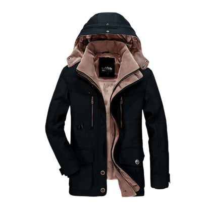 Leonie | Veste longue pour homme | Hiver - Une veste d'hiver élégante pour homme, avec une doublure intérieure en polaire douce, parfaite pour rester au chaud par temps froid. Elle est dotée d'une capuche ajustable, de multiples poches zippées et d'une coupe confortable, alliant style et fonctionnalité pour une protection hivernale optimale.
