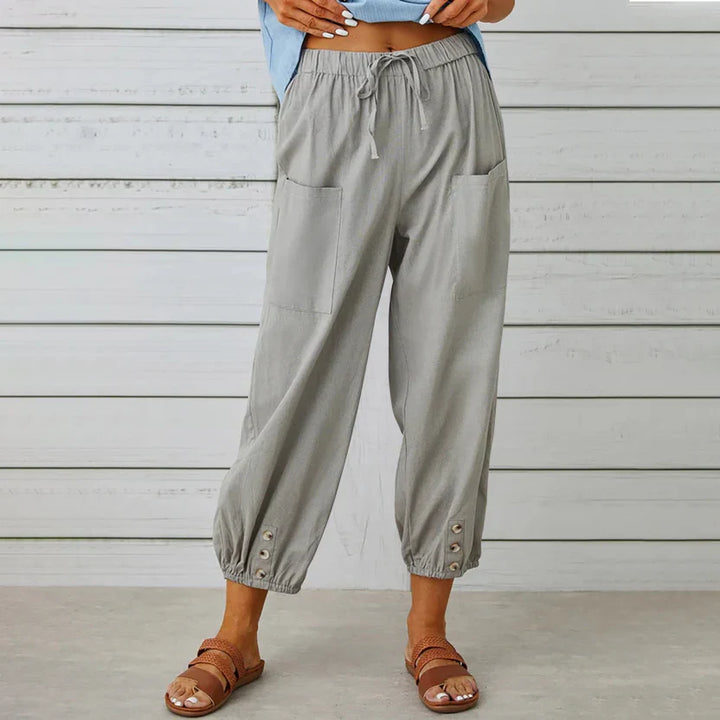 Pantalon Léontine harem ample pour femme, tissu fluide et coupe moderne adaptée aux tenues polyvalentes.