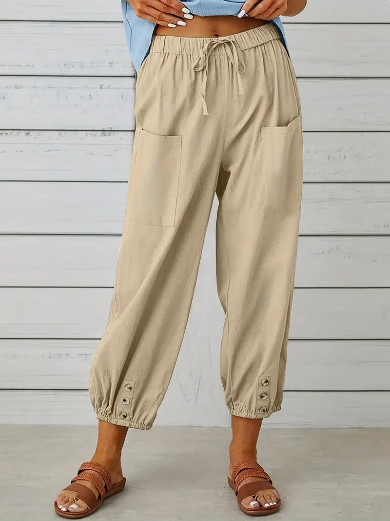 Pantalon Léontine harem ample pour femme, tissu fluide et coupe moderne adaptée aux tenues polyvalentes.