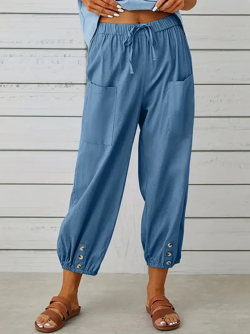 Pantalon Léontine harem ample pour femme, tissu fluide et coupe moderne adaptée aux tenues polyvalentes.