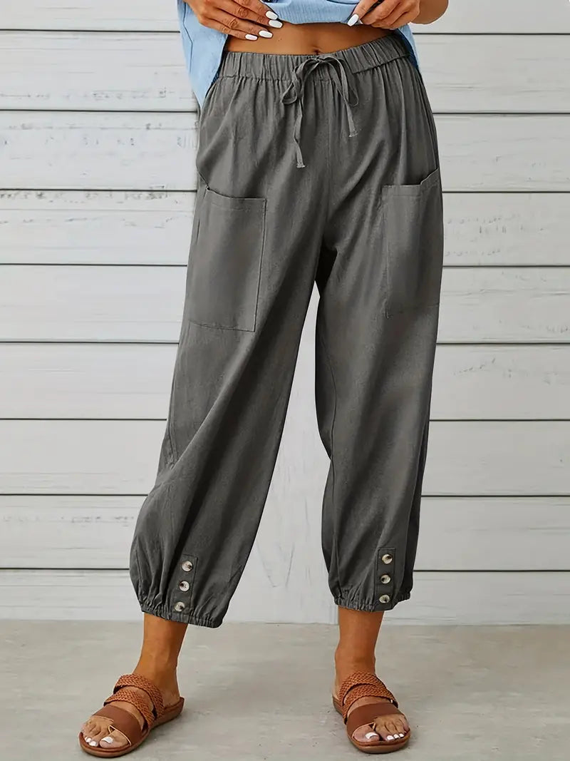 Pantalon Léontine harem ample pour femme, tissu fluide et coupe moderne adaptée aux tenues polyvalentes.