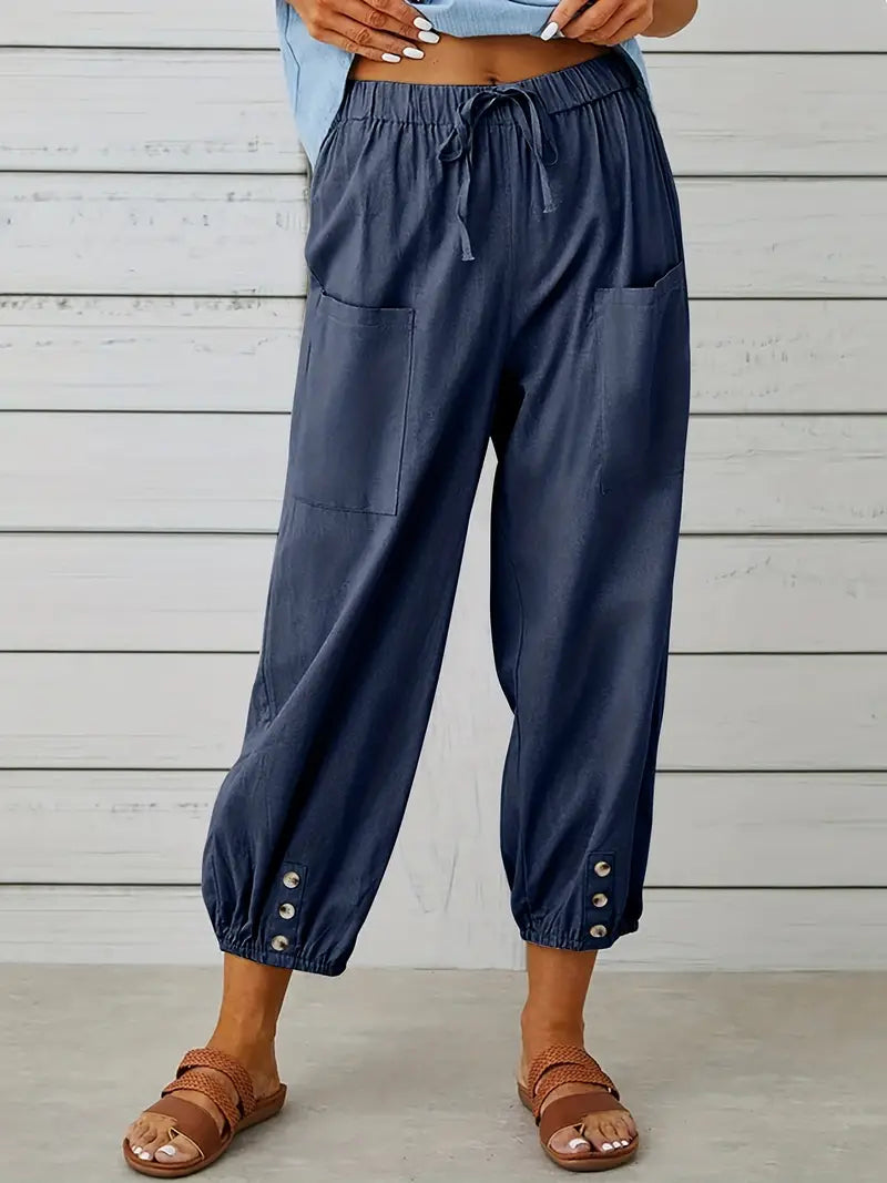 Pantalon Léontine harem ample pour femme, tissu fluide et coupe moderne adaptée aux tenues polyvalentes.