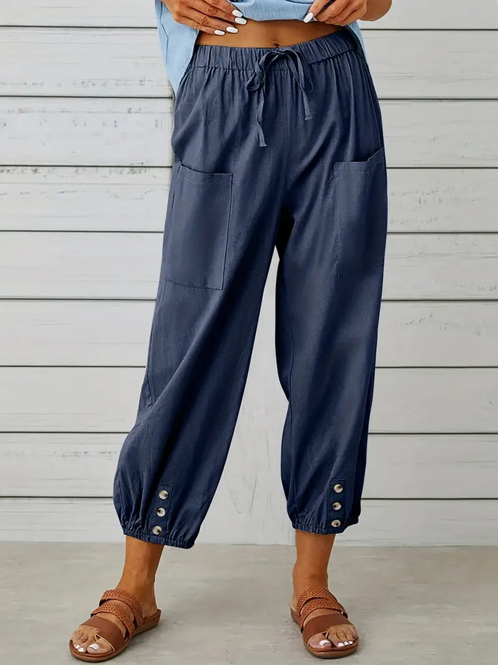 Pantalon Léontine harem ample pour femme, tissu fluide et coupe moderne adaptée aux tenues polyvalentes.