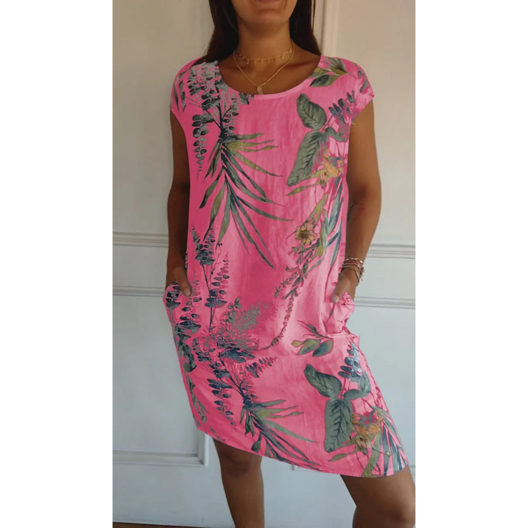 Cette robe d'été en lin, de couleur rose vif avec un imprimé tropical, est idéale pour un look estival vibrant. Sa coupe décontractée et ses poches latérales ajoutent confort et style, parfaite pour les journées ensoleillées.