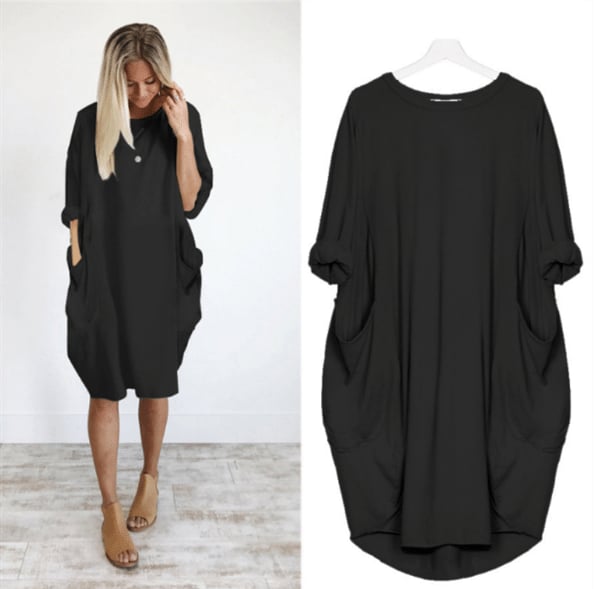 robe ample noire à manches 3/4, col rond, poches latérales, coupe fluide et confortable, présentée portée et sur cintre.