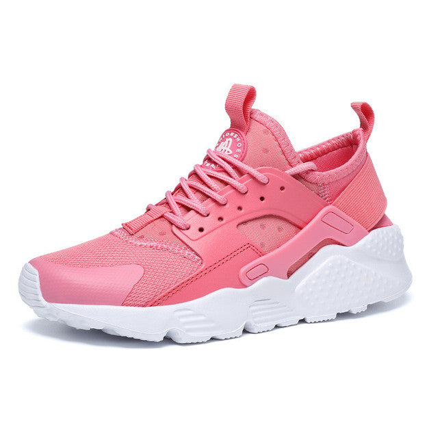 Sneaker rose en mesh respirant, avec lacets et empiècements, semelle épaisse blanche amortissante, style urbain.