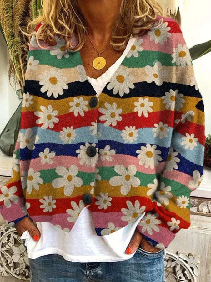 Apportez chaleur et style avec le cardigan long Nadia. Parfait pour les journées fraîches, ce cardigan chic présente un design confortable et moderne, orné de fleurs et de couleurs vibrantes. Un incontournable pour rester cosy tout en restant tendance.