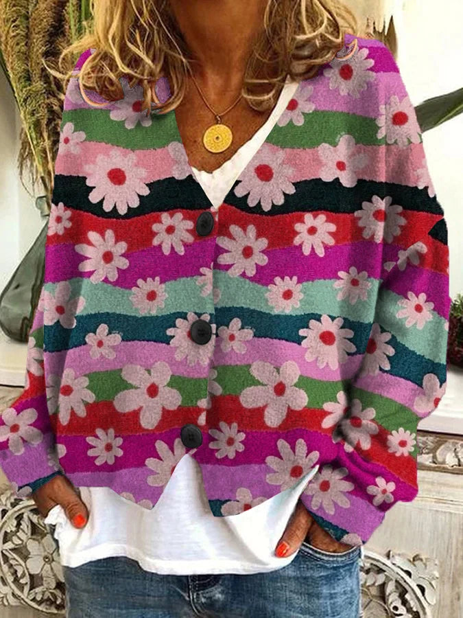 Ajoutez une touche de couleur à votre garde-robe avec le cardigan long Nadia. Avec son design floral vibrant et ses teintes éclatantes, il vous garde au chaud tout en étant élégant et confortable, idéal pour les journées fraîches.