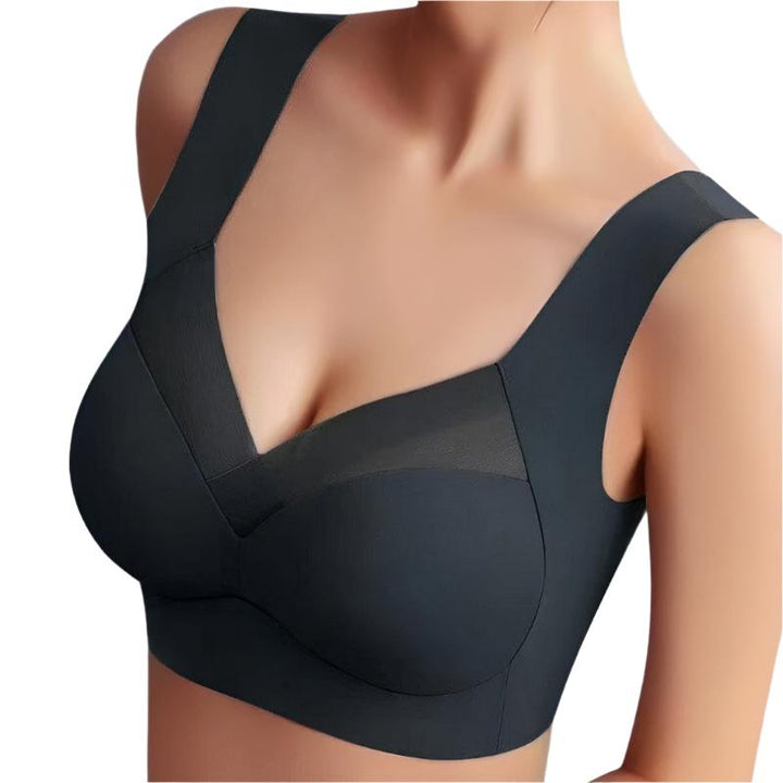 Soutien-gorge seamless noir avec des bonnets lisses et des bretelles larges pour un maintien optimal. Le design sans coutures et la maille subtile sur le devant assurent un confort maximal, offrant un look élégant et moderne.