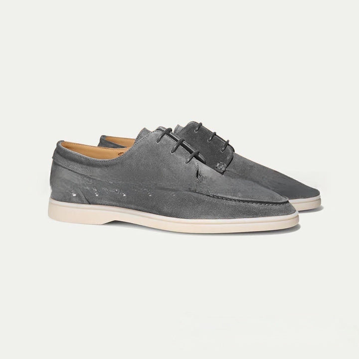 Paire de mocassins à lacets Paulin pour homme en suédine grise, avec design moderne et semelle claire contrastante, idéale pour un style élégant et tendance.