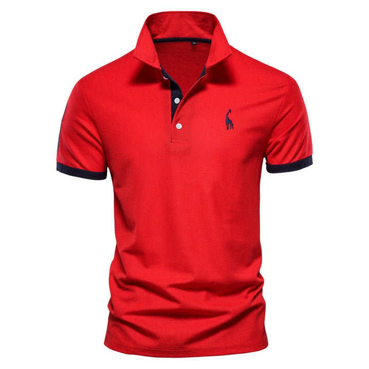 Polo homme Philippe tendance en rouge vif, avec col classique à boutons et détails contrastés sur les manches et l’intérieur du col, pour un style moderne et dynamique.