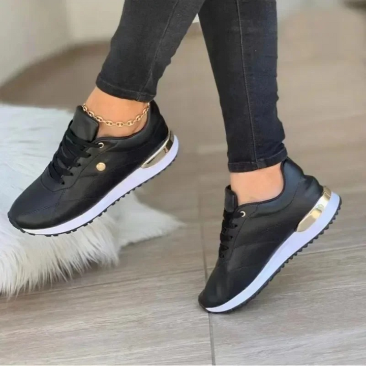 Sneakers Ella en similicuir pour femme, semelle confortable adaptée aux tenues polyvalentes toute saison.