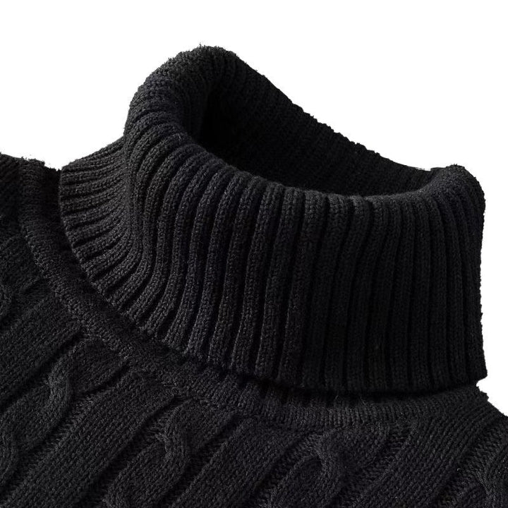 Pull en maille torsadée noir avec col roulé épais, offrant chaleur, confort et style pour l’hiver.