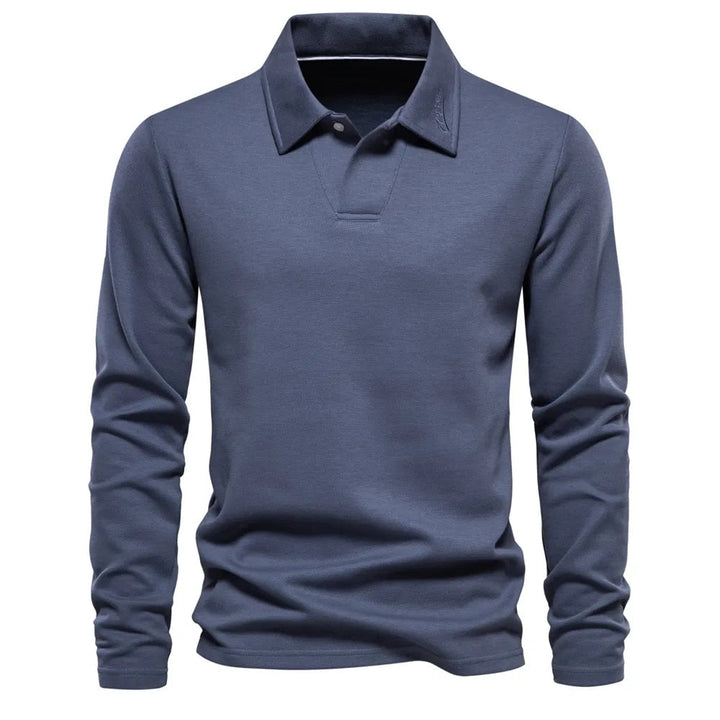 Polo homme bleu ardoise à manches longues, coupe ajustée et design moderne, avec col classique et finition épurée.