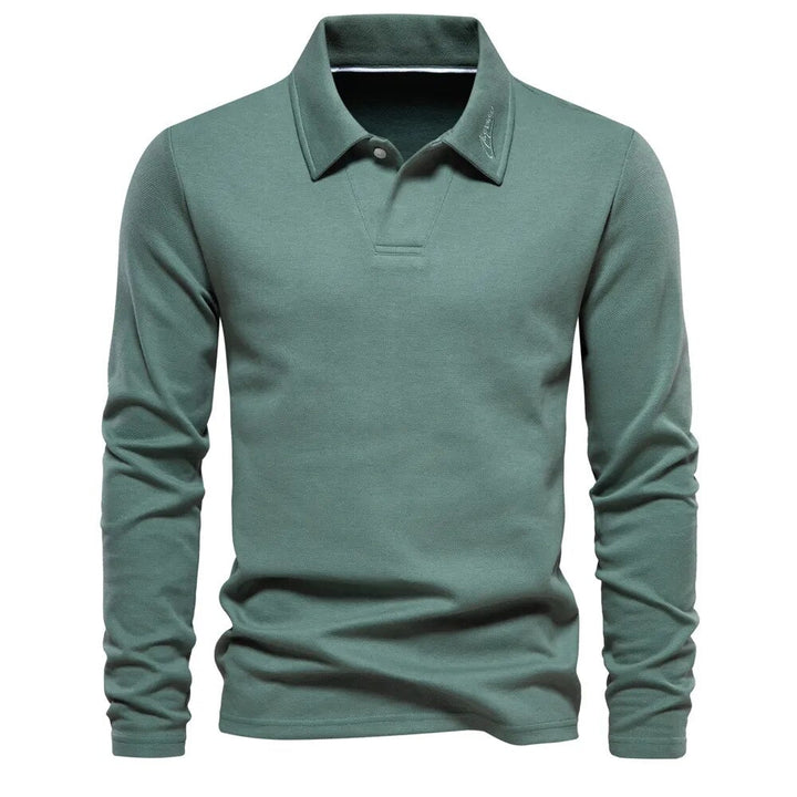 Polo homme vert à manches longues, coupe ajustée et style moderne, avec col classique et design épuré.