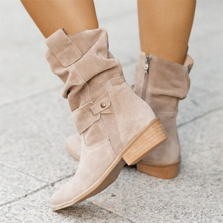 Bottines hautes Veloria pour femme, tige mi-haute brune adaptée aux tenues automnales polyvalentes.