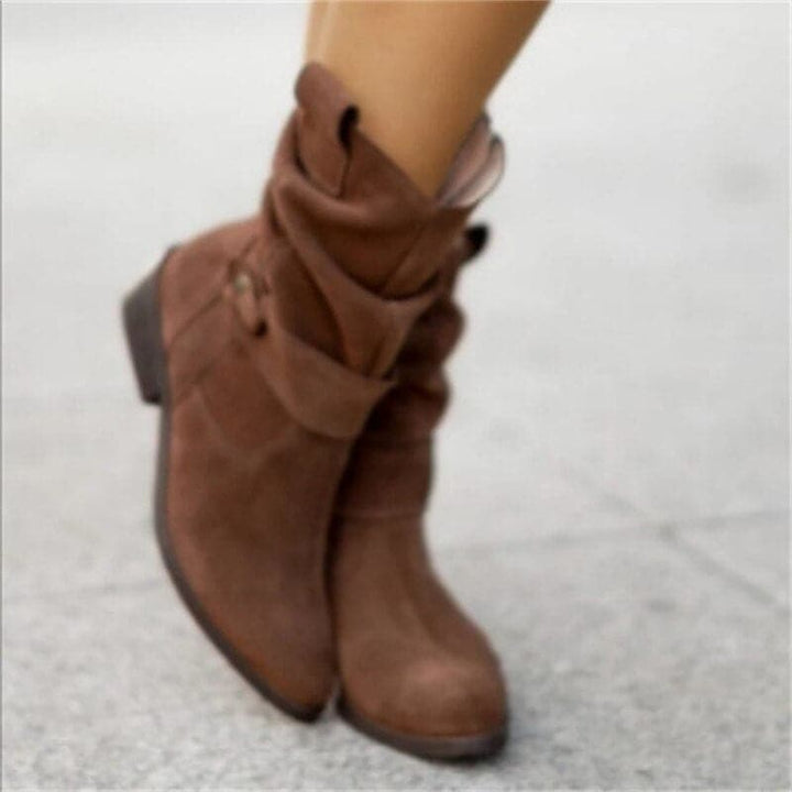 Bottines hautes Veloria pour femme, tige mi-haute brune adaptée aux tenues automnales polyvalentes.
