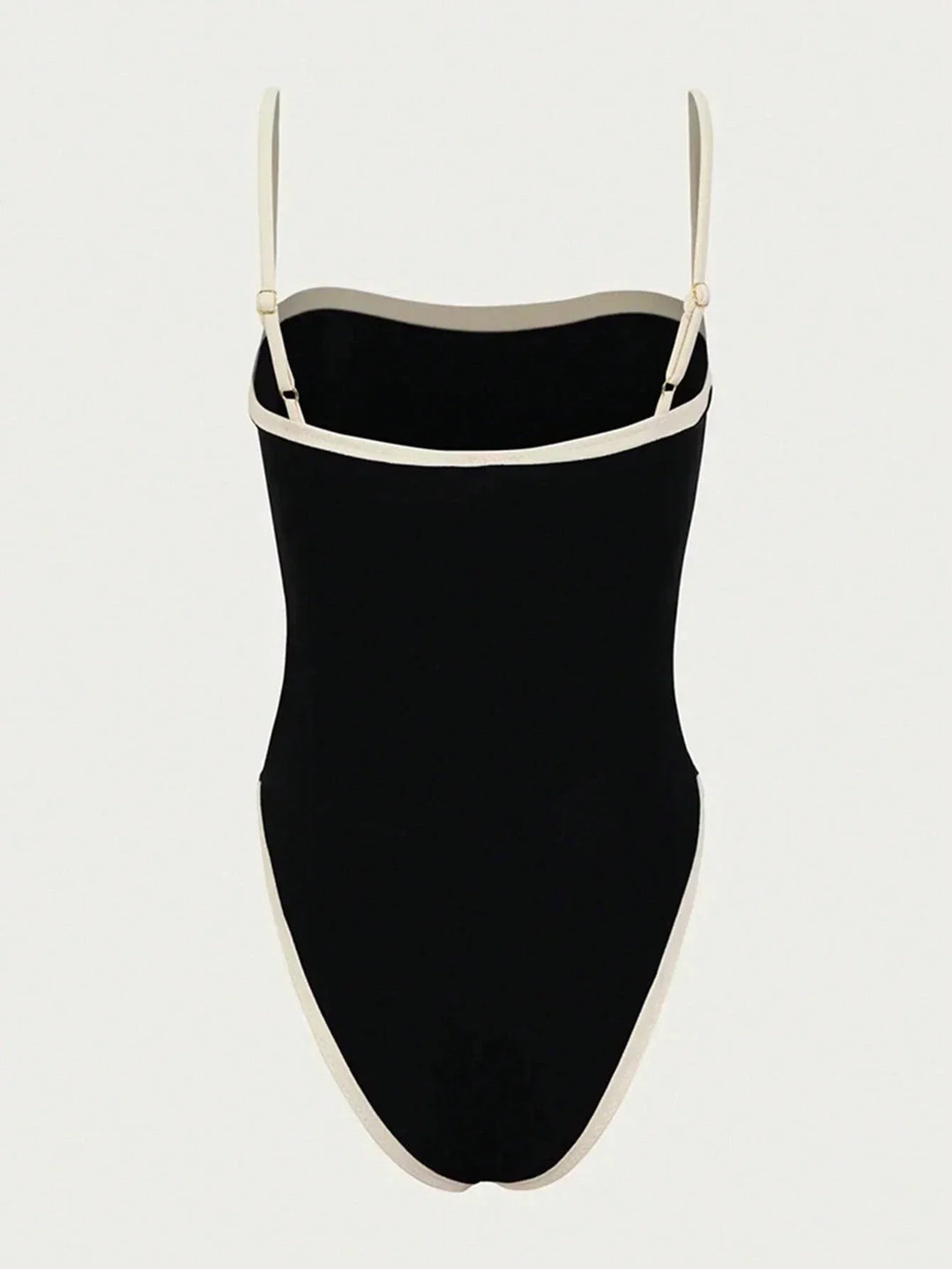 Maillot de bain une pièce noir avec des bretelles fines et des détails en contraste blanc. Design moderne et élégant, parfait pour la plage ou la piscine, avec une coupe épurée et tendance.