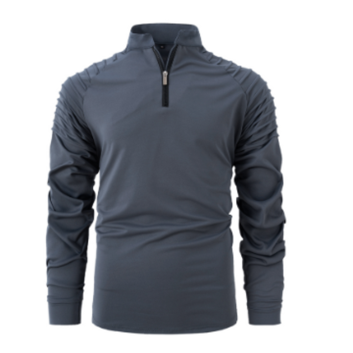 Polo pour homme Xavier, moderne et élégant, de couleur gris anthracite. Ce polo à manches longues présente des détails sur les épaules et un zip noir au col. Idéal pour un look sportif et raffiné, il allie confort et style contemporain.